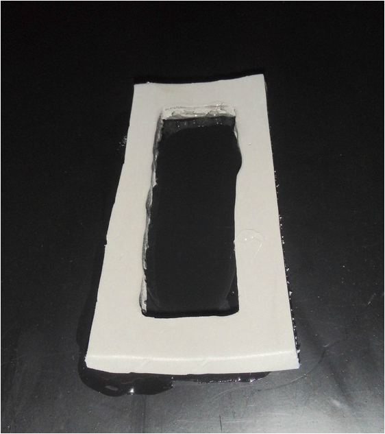 Marine Goop inside the hull for installing the transducer