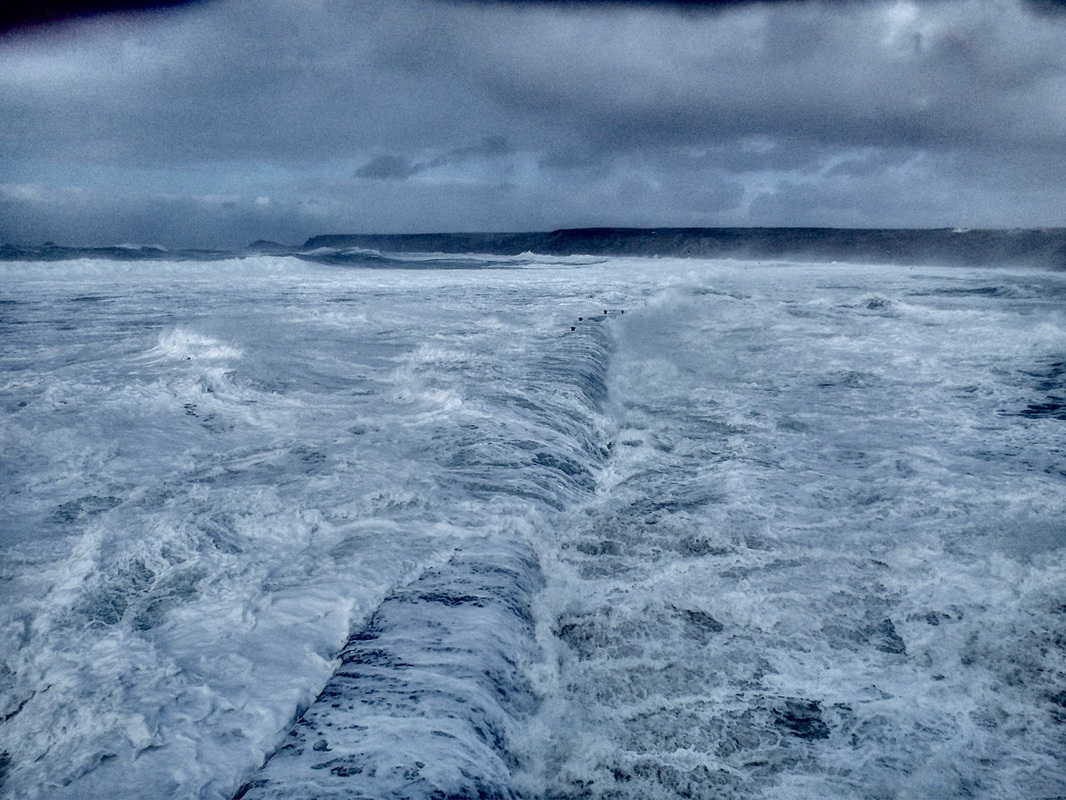 Big swell breaking over Sennen Breakwater during Storm Imogen