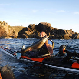 Craig with a nice Pollack at the Penzance Kayak Fishing Meet 2017